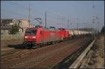 DB Schenker 145 004-8 und Wagenlok 298 309-6 mit einem Kesselzug Richtung Eberswalde (gesehen Joachimsthal 26.02.2011)