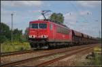 DB Schenker 155 008-6 mit Facs-Wagen am 20.08.2011 in der Berliner Wuhlheide