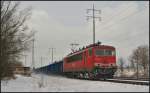 DB Schenker 155 115 mit Eaos-Wagen vpn PKP Cargo am 12.03.2013 in Diedersdorf