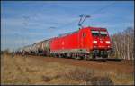 DB Schenker 185 231-8 mit einem Kesselwagenzug am 20.03.2014 durch die Berliner Wuhlheide