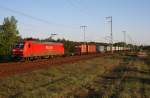 DB Schenker 145 057-6 mit Container-Zug in der abendlichen Sonne (gesichtet Berlin Wuhlheide 24.04.2009).