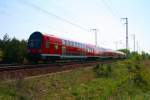 Umleiter des RE3 nach Stralsund geschoben von DB Regio 114 013-6 (Berlin Wuhlheide, 24.04.2009).