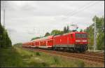 DB Regio 112 123 mit dem RE1 Berlin-Charlottenburg fhrt am 10.05.2012 durch Berlin-Friedrichshagen