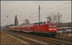 DB Regio 112 104 schiebt am 07.03.2013 den RE3 Eberswalde Hbf durch Berlin-Karow