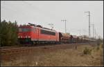 DB Schenker 155 138 mit Schttgut-Zug am 09.04.2013 in der Berliner Wuhlheide