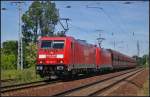 DB Schenker 185 303 und 185 316 am 05.06.2013 mit einem Erz-Zug in der Berliner Wuhlheide