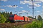 DB Schenker 185 210-2 mit Schttgut am 28.08.2014 durch die Berliner Wuhlheide